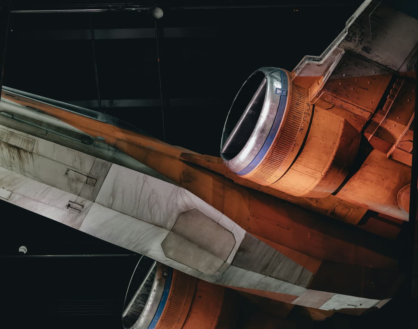Close-up of a turbofan jet engine in an aircraft hangar, representing hardware where wear accumulates and RUL is estimated.